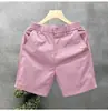 Pantalones cortos casuales minimalistas de alta gama para hombre, marca de moda, ropa casual de lujo, pantalones cortos blancos ajustados de verano para hombre