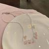 Collar de flores con pequeñas cuentas de arroz para mujer, dulce y lindo, diseño de alta gama, cadena de clavícula con nicho de sentido, collar del mismo estilo de celebridad de Internet.