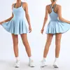 Vestido de yoga unitario transfronterizo de comercio exterior europeo y americano para mujer con almohadillas en el pecho, top tipo tank con espalda cruzada de bloques de color, falda plisada para golf y tenis