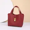 Bolso de mano de mujer más vendido transfronterizo, bolso de mano de lujo ligero, nuevo bolso tipo cubo de piel de vaca de capa superior para mujer, bolso tipo cesta de cuero genuino cruzado