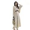 Nuevo conjunto de dos piezas para mujer de verano: suéter de punto hueco, camisa de aire acondicionado, top, cárdigan, chaqueta y falda para mujer