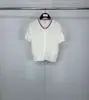 Venda Direta da Fábrica Tb Verão Novo Gola Redonda Manga Curta Estampa Ondas de Água Feminino Casual, Confortável e Versátil Botão Manga Curta