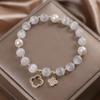2024 nova pulseira de pedra olho de gato feminino trevo de quatro folhas pulseira de cristal corda elástica pérola transferência conta corda de mão atacado