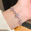 Pulseira de fecho geométrico com flor de zircônia estilo coreano, pulseira elegante para o dia a dia do trabalhador, joia versátil de luxo leve e nicho para atacado