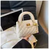 Bolsa de corrente estilo francês com padrão de losangos de nicho para mulheres, nova moda primavera-verão 2026, bolsa de mão pequena para ombro e transversal para o dia a dia