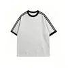Camiseta de manga corta con cuello redondo estilo americano, unisex, nuevo modelo de verano, holgada y versátil, top con bloques de color, asequible para comercio exterior