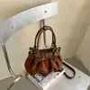Bolsa de nuvem com laço de camurça estilo coreano, nicho, para mulheres, nova moda outono e inverno 2026, bolsa de ombro e transversal para o dia a dia