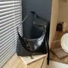 Bolso de axila texturizado transfronterizo para mujer, nuevo modelo 2026, bolso simple de media luna, bolso versátil para hombro y cruzado