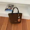 Bolso tipo cubo estilo retro para mujer, nueva colección otoño 2026, diseño coreano simple y casual, alta calidad, bolso de hombro de color liso