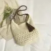 Bolsa de Palha Trançada Vazada Estilo Floresta 2026 Novo Modelo Grande Capacidade Estilo Preguiçoso Bolsa de Ombro de Braço Bolsa de Praia para Férias na Costa