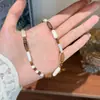 Moda Retro Exquisito Versátil Piedra Natural Ojo de Tigre Concha Collar de Cuentas Lujo Accesible Nicho Cadena para Clavícula de Gama Alta