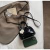 Bolsa de Ombro Feminina 2026 Primavera Novo Estilo Simples Versátil Tendência Casual Nicho Bolsa Transversal para Carregar na Mão Moda Bolsa Concha
