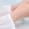 Pulsera de perlas con un estilo exquisito y elegante, que recuerda a una heredera adinerada, en un color plateado brillante con perlas redondas y de concha brillantes, una pulsera para mujer