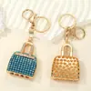 Estilo de Moda de Lujo Ligero Europeo y Americano Mini Bolso de Mano Completamente Cubierto de Diamantes Colgante para Llavero Diseño de Nicho Accesorio para Bolso de Mujer