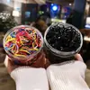 Ligas desechables para niños en caja, ligas de goma de color negro, ligas de goma de color gelatina, cuerda para el cabello, pequeña cubierta de cuero, cuerda para el cabello, joyería al por mayor