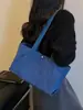 Bolsas de lona casuales de nicho al por mayor para mujer, nuevo bolso tote simple de color liso de gran capacidad, bolso de hombro para el antebrazo para el trabajo
