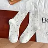 Calcetines holgados de otoño e invierno, amigables con la piel y cómodos, calcetines de media pantorrilla con estampado floral pequeño para mujer, calcetines largos versátiles estilo Ins, calcetines de algodón peinado para mujer