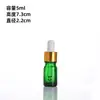 Botella de vidrio de color para aceite esencial con gotero de punta de plástico graduada, botella a prueba de luz para sérum, botella de empaque para sérum, botella dispensadora