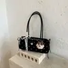 Bolso de hombro con lazo de lunares de moda transfronterizo para mujer, nuevo y elegante bolso de hombro de nicho 2026, bolso de trabajo