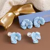 Aretes de Clip para Oreja con Esmalte Azul Goteante Flor Floreciente Zircón Disco para Mosquiteros Pendientes Elegantes de Viajero de Nicho Exquisitos y Versátiles