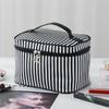 Bolsa de cosméticos de celebridades de Internet, gran capacidad, nuevo estilo Ins, súper popular, portátil, para mujeres, viaje, portátil, simple, bolsa de almacenamiento para artículos de tocador.