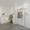 Estante de acero inoxidable con trefilado para tienda de ropa, perchero de pared para ropa infantil, ideal para tiendas de ropa de mujer.