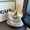 Bolso tejido transfronterizo 2026 otoño nuevo moda versátil gran capacidad bolsa de vacaciones playa hombro axila