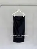 Saia de couro PU retrô americana Youji CZZHANG feminina outono novo produto fenda bodycon meia saia C32626