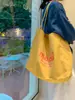 Nuevo bolso de hombro grande para mujer estilo coreano 2026, bolso de mano casual para estudiante con estampado de letras, bolso tote dopamina