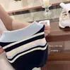 Conjunto de Niña 2026 Verano Nuevo Elegante Chaleco de Punto Polo y Falda Corta a Cuadros Conjunto de Dos Piezas Moderno