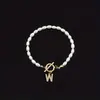 Pulsera de Moda de Venta Caliente Transfronteriza 2026 con Diamantes y 26 Letras, Pulsera de Perlas de Imitación Ovaladas, Disponible para Venta al por Mayor para Mujeres