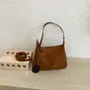 Diseño de nicho con un toque de alta gama, nuevo bolso cruzado de ante esmerilado estilo perezoso retro para el antebrazo, hombro o bandolera para mujer 2026