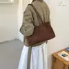 Bolso de mano de moda casual de un solo hombro gran capacidad 2026 versátil para el trabajo de otoño gamuza nuevo bolso simple para mujer estilo coreano