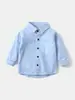 Camisa Infantil Atacado 2026 Novidades Camisa Manga Longa para Meninos Roupa de Bebê Cor Sólida Bolso Patch Moda Outono