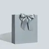 Embalagem Laço de Presente Sacola de Papel de Mão Sacola de Compras Pronta Exportação Transfronteiriça Impressão Logotipo Personalizado Fabricante Frete Grátis