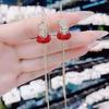 Exquisitos Aretes Coreanos Retro Super Flash con Borla de Bolsa de la Suerte Incrustada de Diamantes, Personalizados, Elegantes y Grandiosos, Aretes Únicos al por Mayor