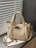 Bolsa para el trabajo, Lujo ligero de nicho estilo coreano 2026 Nueva moda, Bolso tipo cesta cubo, Bolso de mano retro simple para mujer
