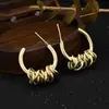 Pendientes retorcidos de personalidad retro transfronterizos pendientes de personalidad de alta gama con sentido de lujo para mujer pendientes exagerados de estilo frío al por mayor