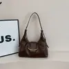 Bolsa de axila feminina grande, texturizada, estilosa e minimalista, nova bolsa de lua de design de nicho, bolsa de ombro e transversal