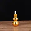 Botella de aceite esencial galvanizado doble calabaza vidrio cabeza de goma gotero botella cosméticos sub-embotellado botella de esencia multi-especificación botella vacía