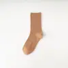 Calcetines de tubo lisos de otoño e invierno para mujer, calcetines de moda casual de punto doble para mujer, calcetines de color liso al por mayor