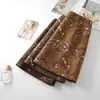 Falda de gamuza bordada jacquard vintage para mujer, otoño, cintura alta, aspecto adelgazante, minifalda Maillard, línea A ajustada a la cadera