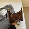 Bolso de hombro Shuai Mi Jia de nicho en forma de media luna, bolso tipo empanada, nuevo bolso de hombro colorblock 2026, bolso de hombro casual, bolso de mano para el trabajo
