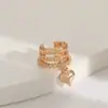 Nuevos aretes de clip de corazón de cobre incrustado estilo europeo y americano transfronterizo para mujeres sin perforaciones, aretes de doble capa únicos y simples estilo ins