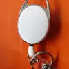 Chaveiro de couro oval transparente de cor sólida retrátil com mosquetão de clipe traseiro puxador de fácil puxada em estoque