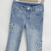Pantalones de mezclilla acampanados deshilachados de nicho modernos de mariposa para mujer 2025 Verano Nuevo Pantalones rectos ajustados elásticos