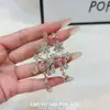 Pendientes elegantes y delicados de estilo francés con diamantes brillantes, diseños florales y de lágrima, y borlas para mujer; moderno, simple, de nicho y versátil