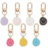 Llavero de cara sonriente de color aleación con goteo transfronterizo de comercio electrónico, accesorios de colgante para bolso con expresión irregular chapado en oro