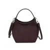 Bolso cubo de ante de diseño nicho coreano para mujer, nueva colección otoño/invierno 2026, bolso de hombro/bandolera de alta gama