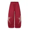 Pantalones casuales de moda juvenil para mujer 2026, nuevos, con patchwork de cinco estrellas decorado, corte regular, pierna curva, venta al por mayor desde una sola fuente, talla 34